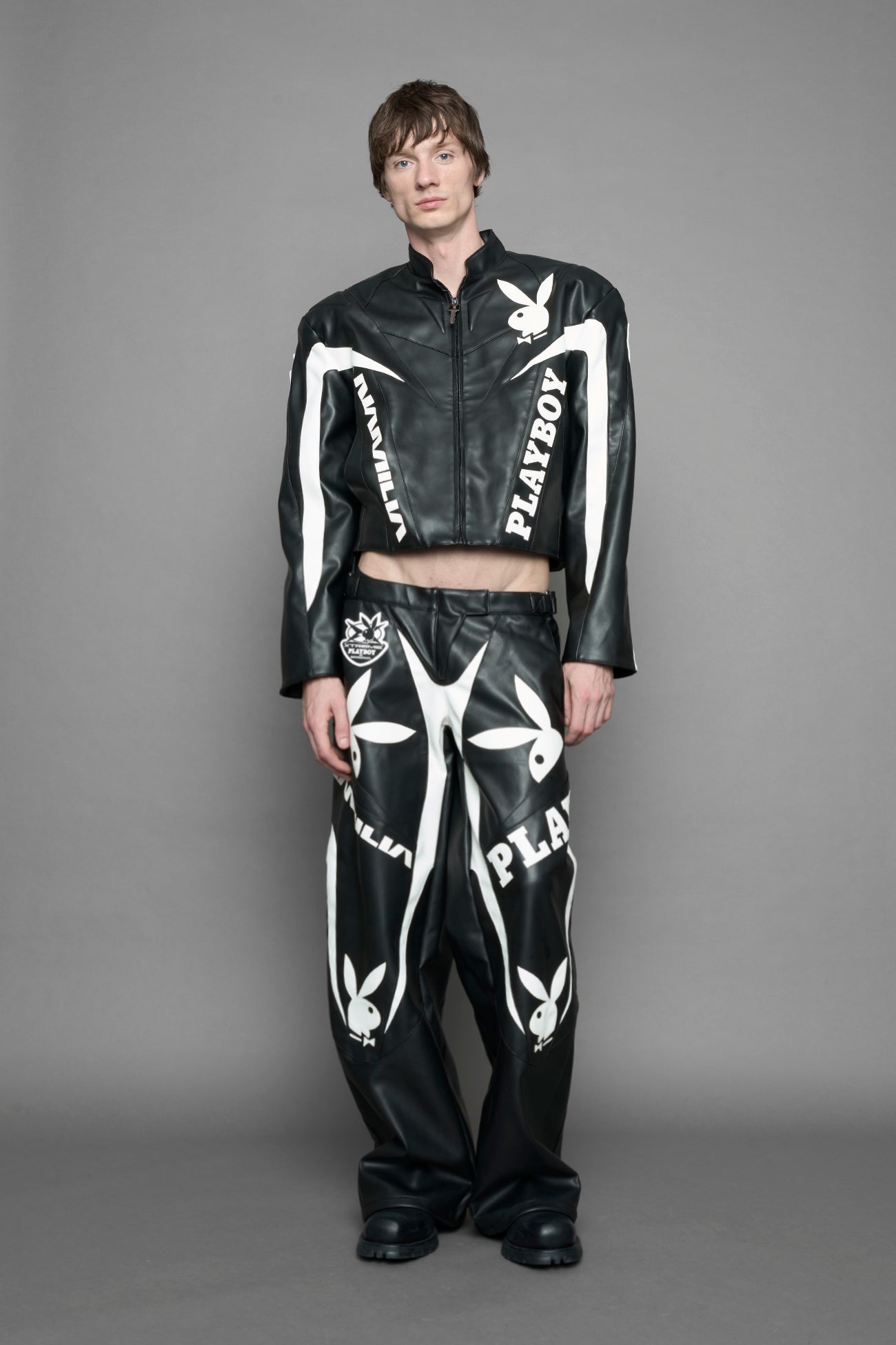 model wearing vegan leather NAMILIA x Playboy biker jacket with broad shoulder design