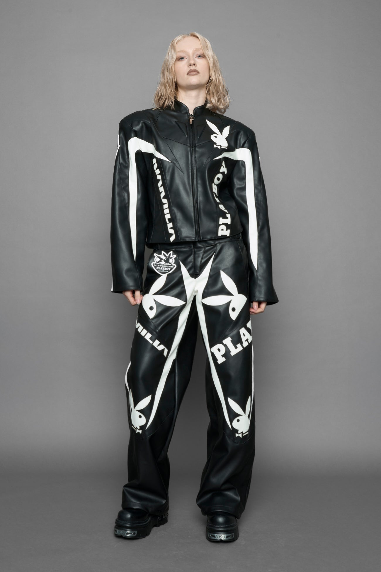model wearing vegan leather NAMILIA x Playboy biker jacket with broad shoulder design