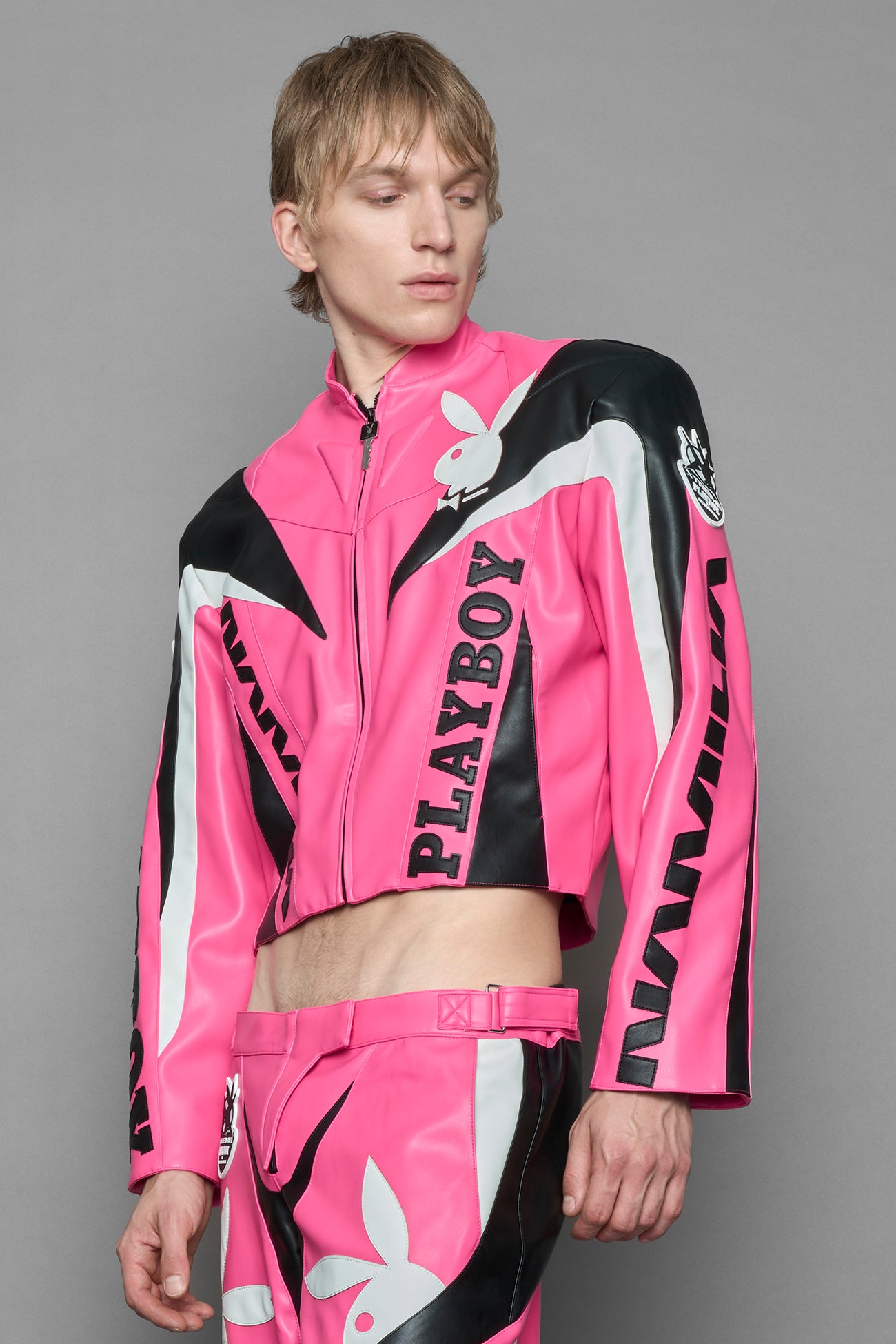 model wearing vegan leather NAMILIA x Playboy biker jacket with broad shoulder design