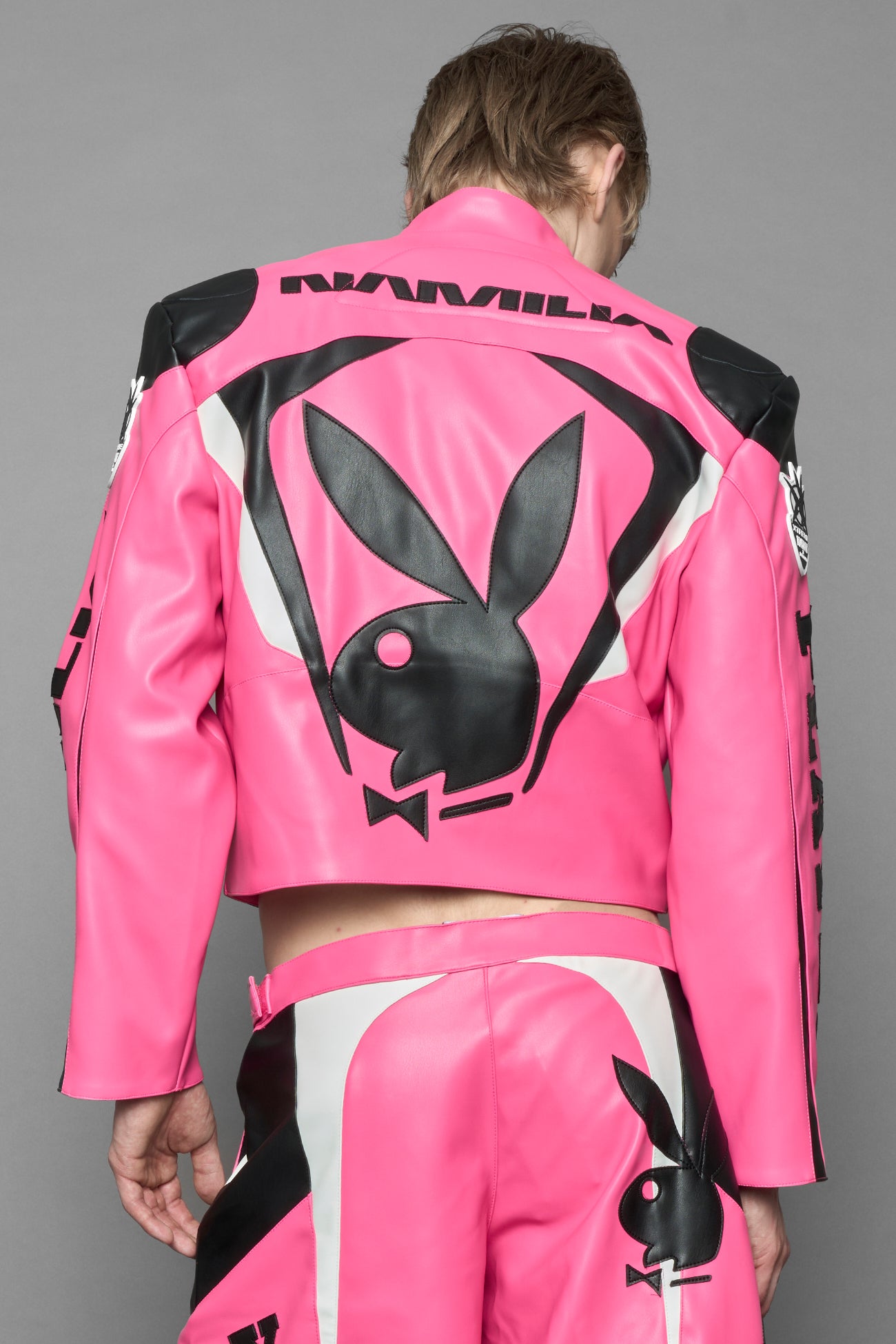 model wearing vegan leather NAMILIA x Playboy biker jacket with broad shoulder design