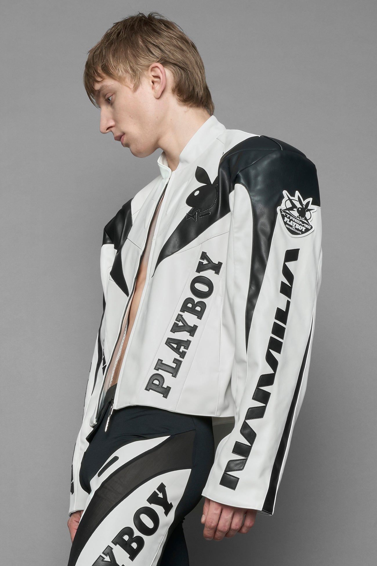 model wearing vegan leather NAMILIA x Playboy biker jacket with broad shoulder design