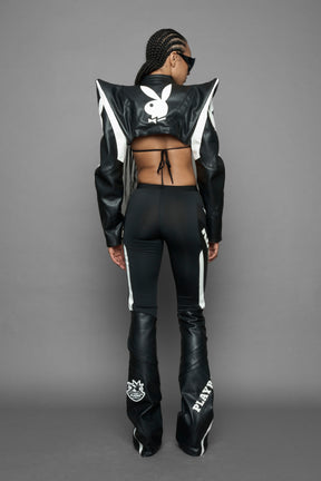 model wearing black white vegan leather NAMILIA x PLAYBOY crop bolero jacket with sharp shoulder design 