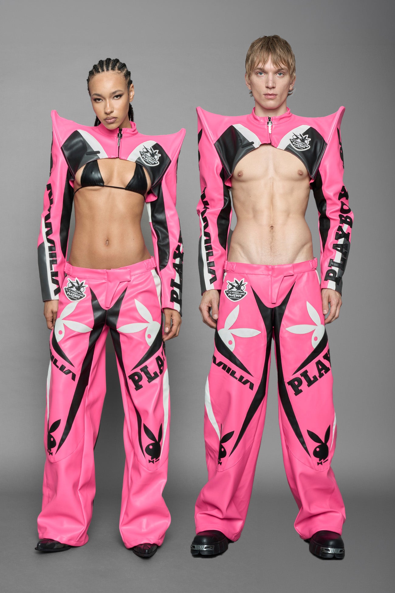 model wearing pink white vegan leather NAMILIA x PLAYBOY crop bolero jacket with sharp shoulder design 