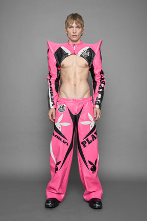 model wearing pink white vegan leather NAMILIA x PLAYBOY crop bolero jacket with sharp shoulder design 