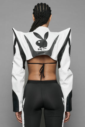 model wearing white vegan leather NAMILIA x PLAYBOY crop bolero jacket with sharp shoulder design 