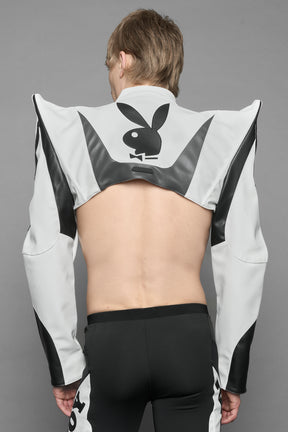 model wearing white vegan leather NAMILIA x PLAYBOY crop bolero jacket with sharp shoulder design 