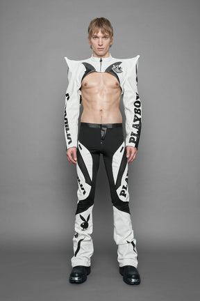 model wearing white vegan leather NAMILIA x PLAYBOY crop bolero jacket with sharp shoulder design 
